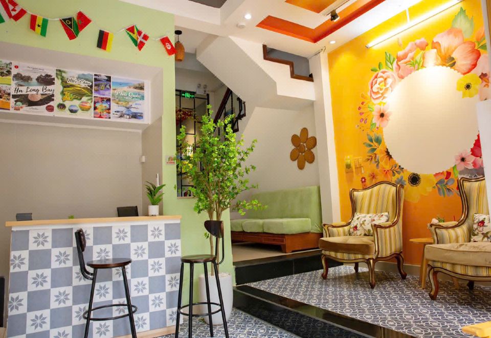 Front desk with patterned tile counter and travel posters